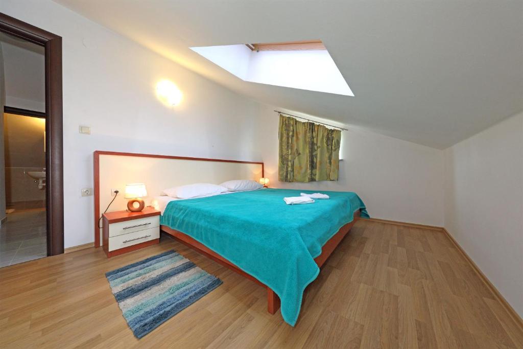 Posteľ alebo postele v izbe v ubytovaní Apartments Andelo II