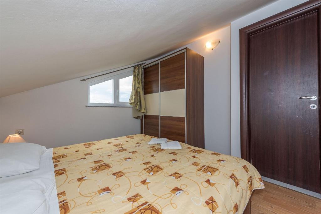 Posteľ alebo postele v izbe v ubytovaní Apartments Andelo II
