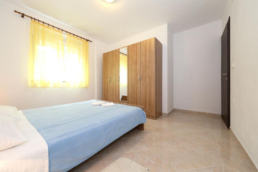 Posteľ alebo postele v izbe v ubytovaní Apartments Andelo II