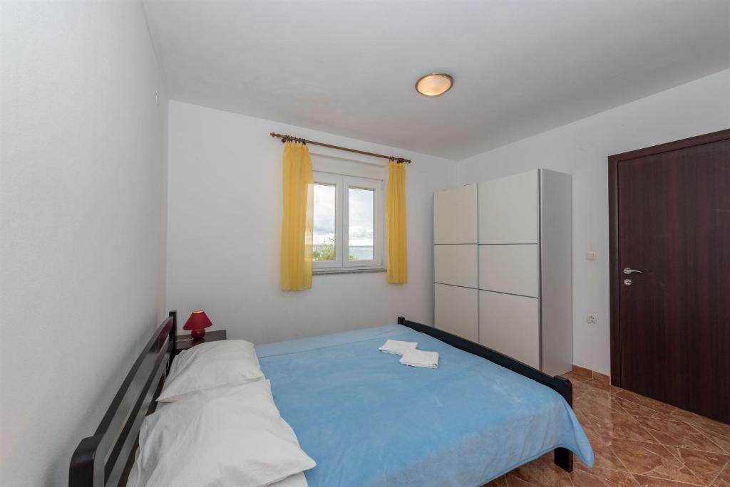 Posteľ alebo postele v izbe v ubytovaní Apartments Andelo II