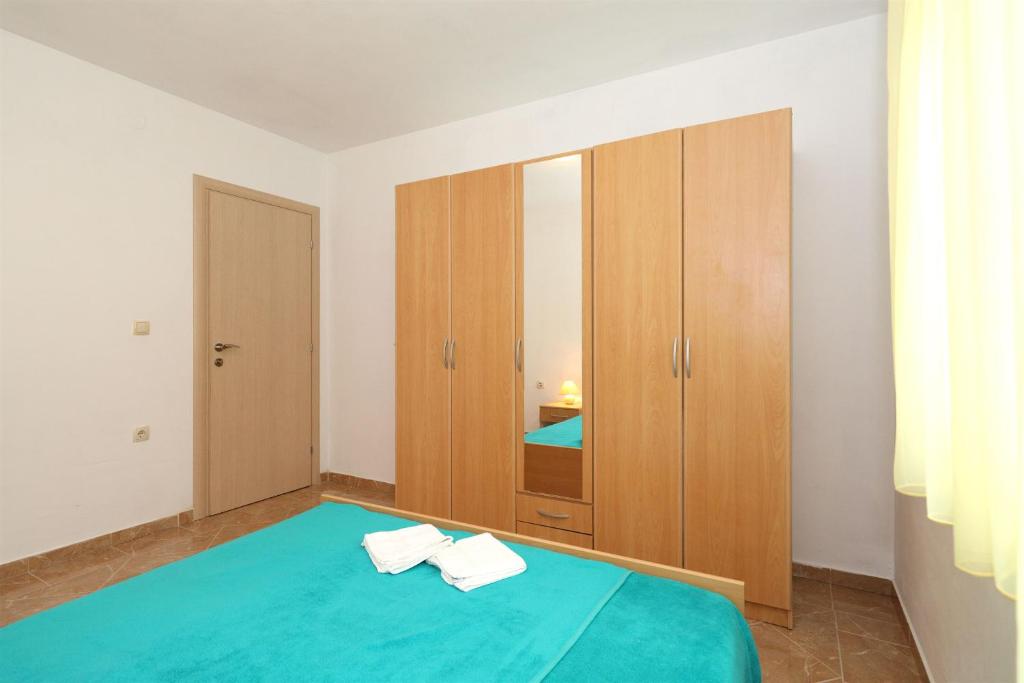 Posteľ alebo postele v izbe v ubytovaní Apartments Andelo II