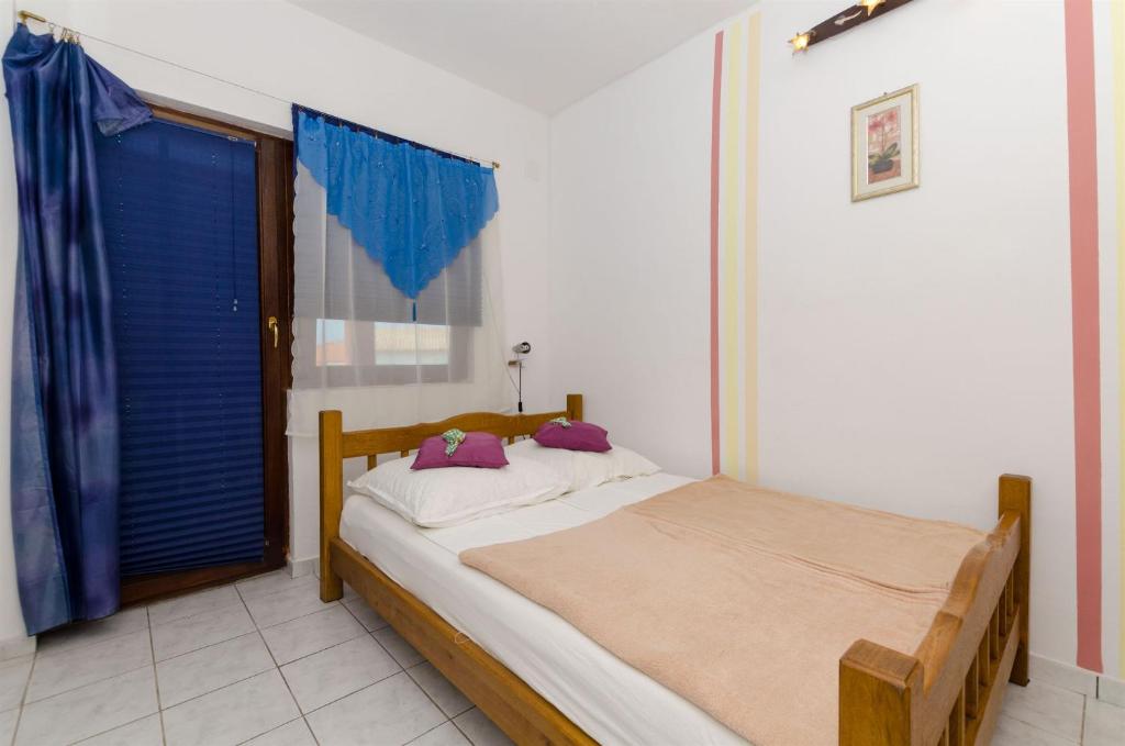 Posteľ alebo postele v izbe v ubytovaní Apartments Ljubica