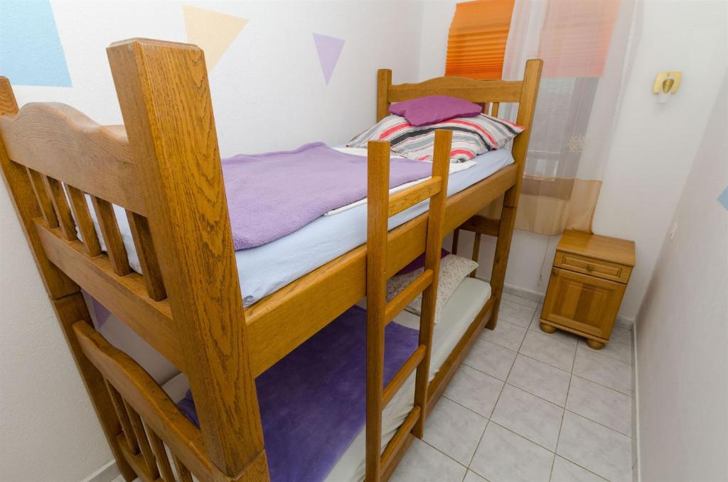 Posteľ alebo postele v izbe v ubytovaní Apartments Ljubica