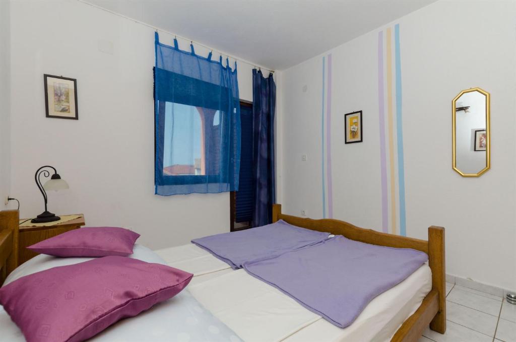 Posteľ alebo postele v izbe v ubytovaní Apartments Ljubica