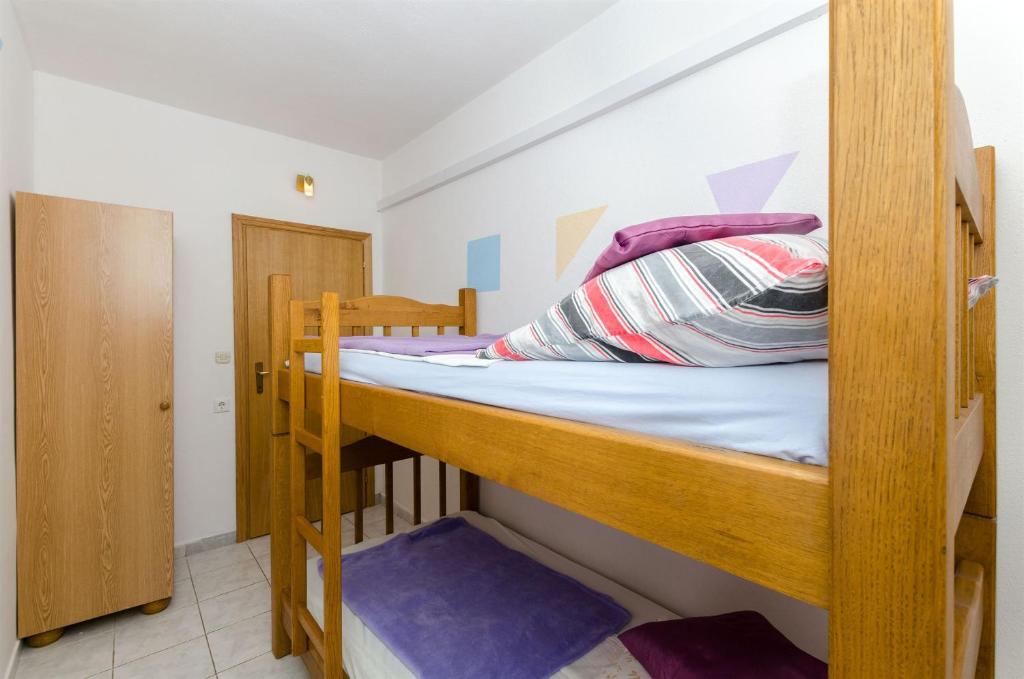 Posteľ alebo postele v izbe v ubytovaní Apartments Ljubica