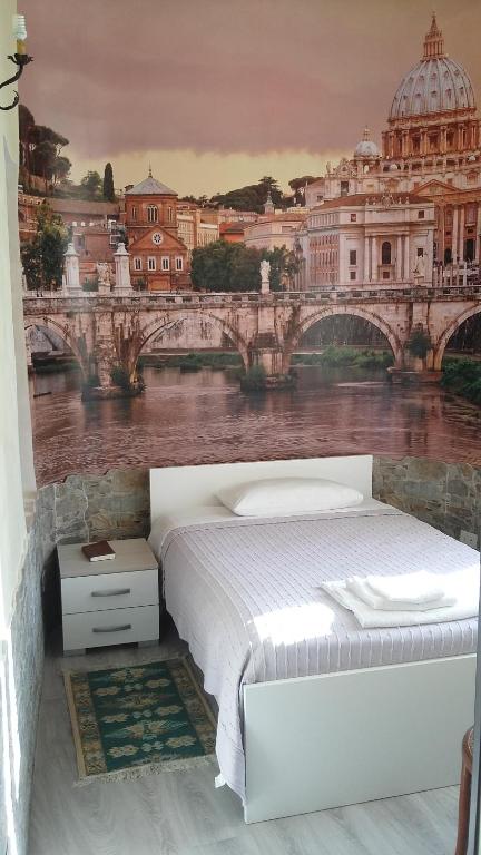 A bed or beds in a room at Palazzo Moraschi Subiaco
