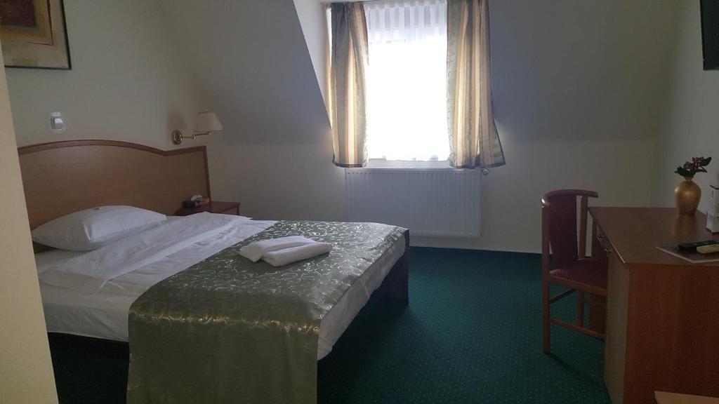 Postel nebo postele na pokoji v ubytování Hotel Melody