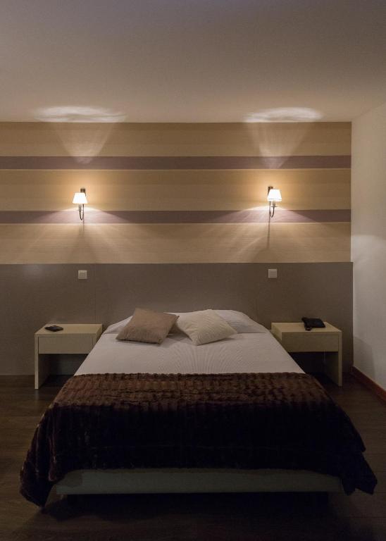Postel nebo postele na pokoji v ubytování Troia Hotel