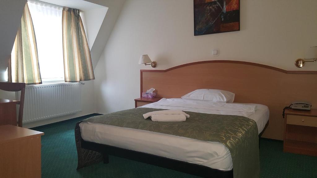 Postel nebo postele na pokoji v ubytování Hotel Melody
