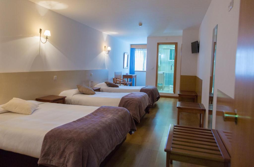 Postel nebo postele na pokoji v ubytování Troia Hotel