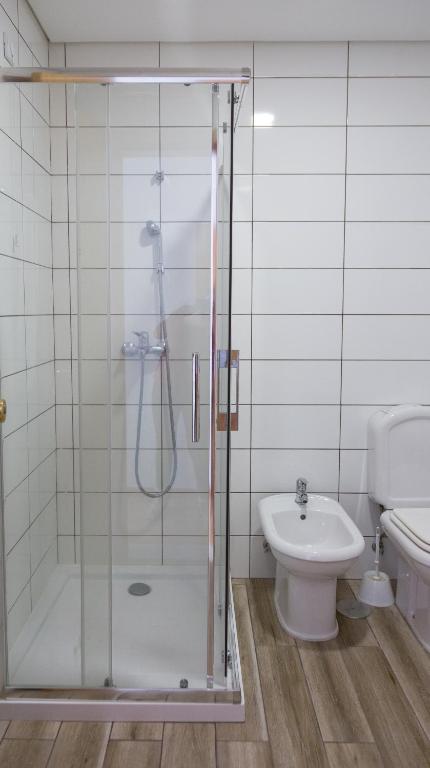 Koupelna v ubytování Troia Hotel