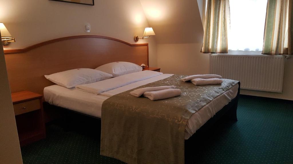Postel nebo postele na pokoji v ubytování Hotel Melody
