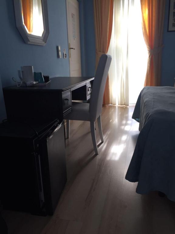 Postel nebo postele na pokoji v ubytování Hotel L'Isola