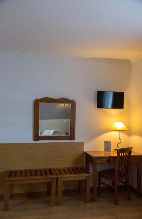 TV a/nebo společenská místnost v ubytování Troia Hotel