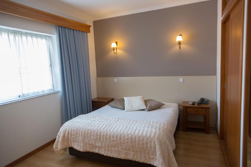 Postel nebo postele na pokoji v ubytování Troia Hotel
