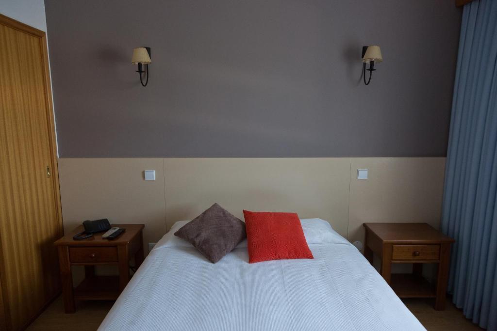 Postel nebo postele na pokoji v ubytování Troia Hotel
