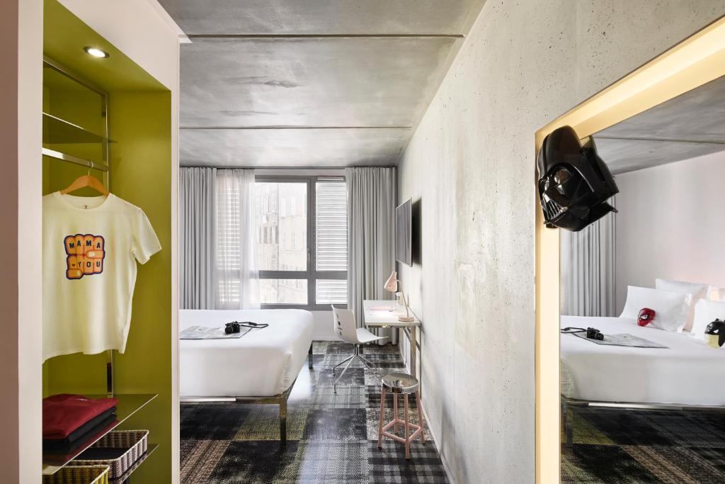a bathroom with two sinks and two white baths at Mama Shelter Marseille in Marseille