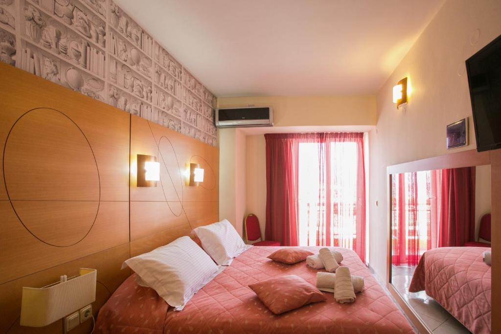 Łóżko lub łóżka w pokoju w obiekcie City Life Port Hotel