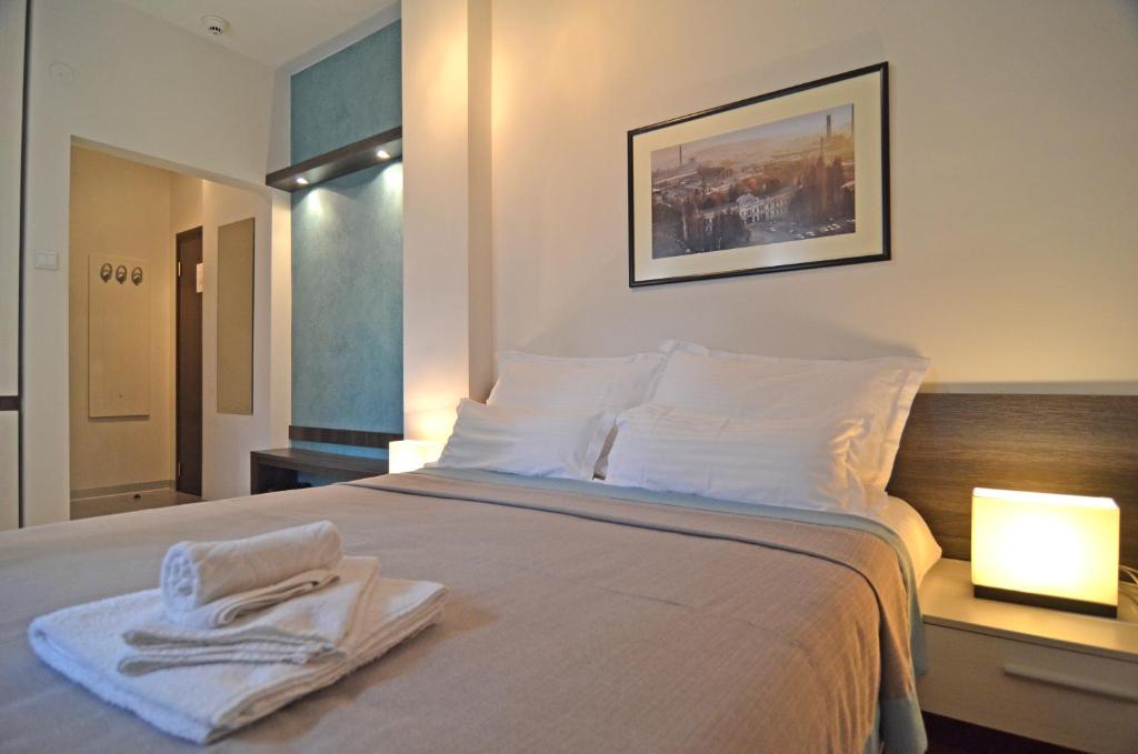 Postel nebo postele na pokoji v ubytování Garni hotel King