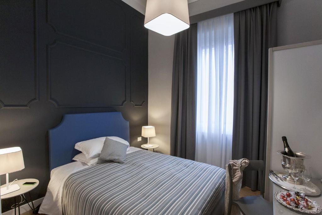 Postel nebo postele na pokoji v ubytování Hotel Il Sole