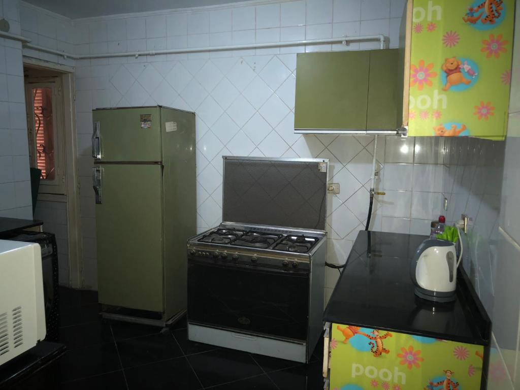 Kuchyň nebo kuchyňský kout v ubytování Family Apartment in Nasr City