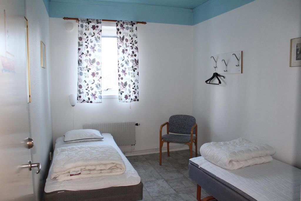 Postel nebo postele na pokoji v ubytování Trosa Vandrarhem