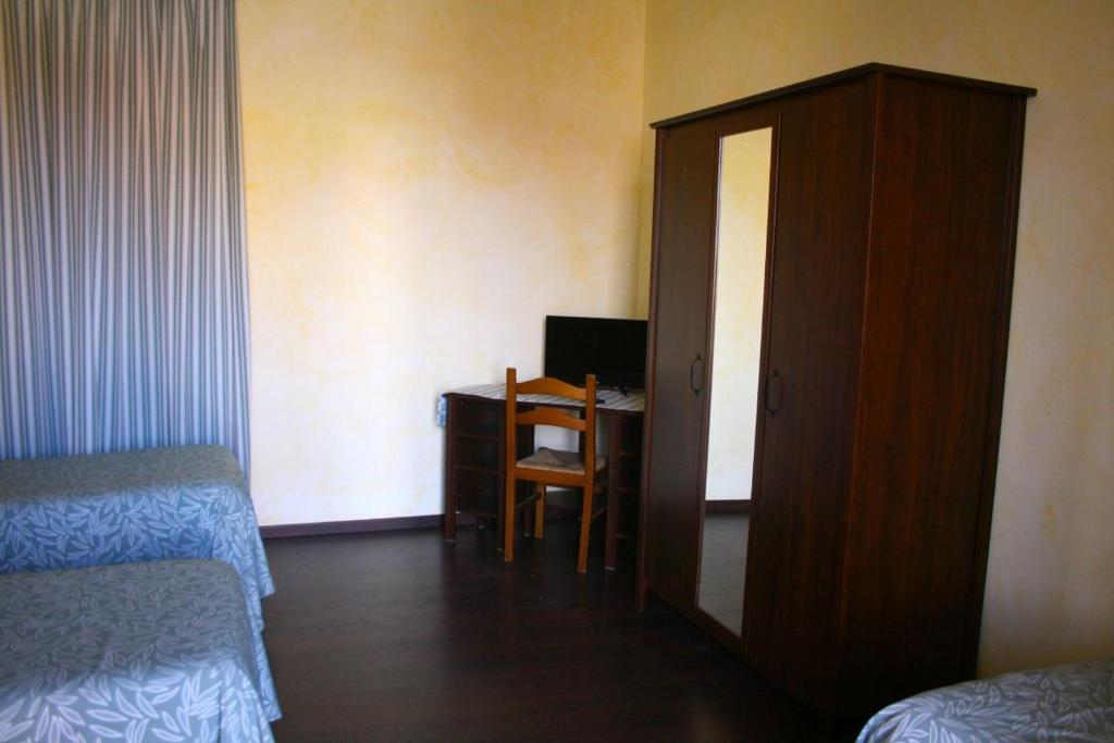 TV a/nebo společenská místnost v ubytování Albergo Vecchio Pavone
