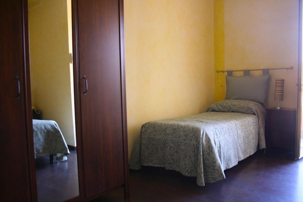 Postel nebo postele na pokoji v ubytování Albergo Vecchio Pavone
