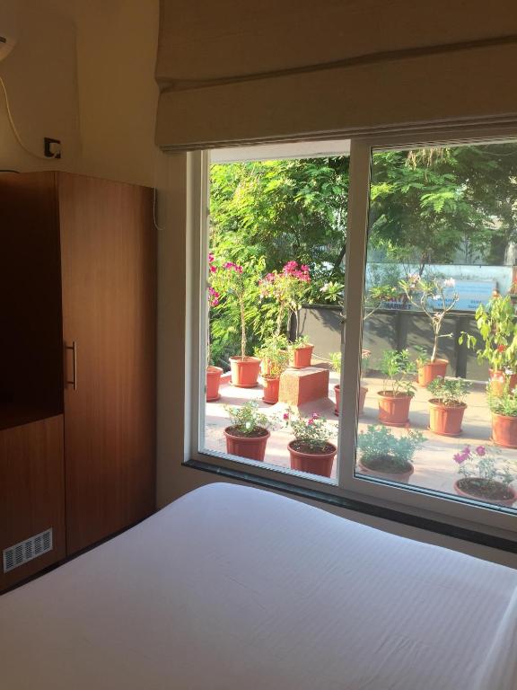 Postel nebo postele na pokoji v ubytování Hotel Cozy Inn