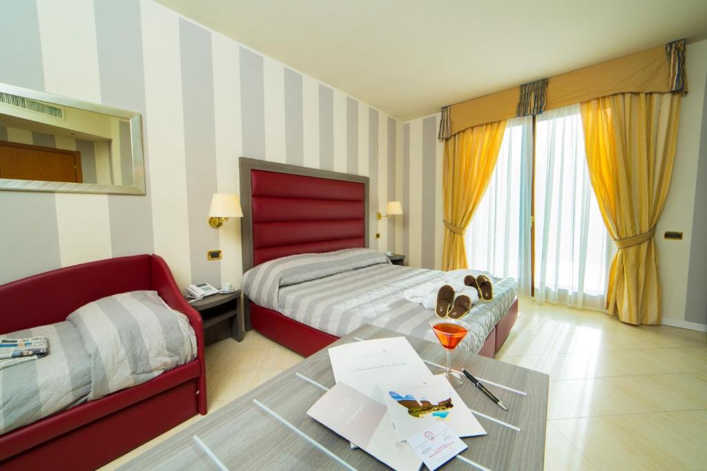 Postel nebo postele na pokoji v ubytování Grand Hotel Elite