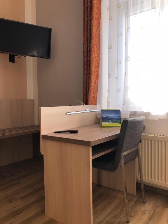 TV a/nebo společenská místnost v ubytování Zum Postamt