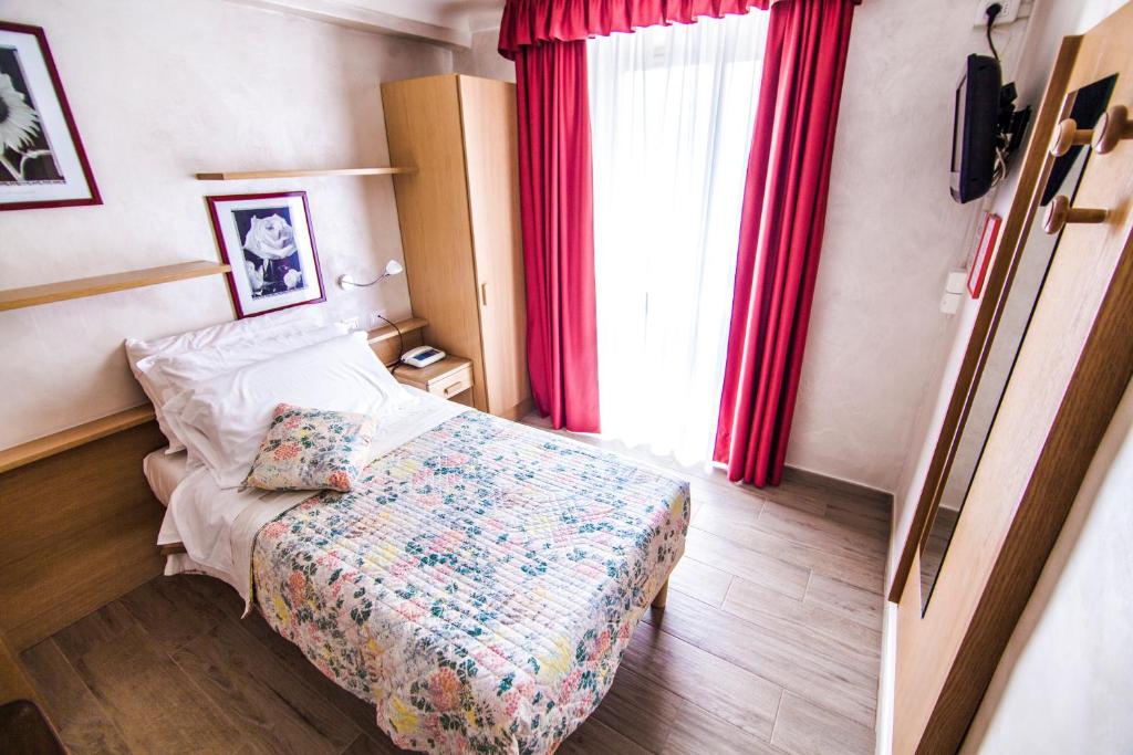 Postel nebo postele na pokoji v ubytování Hotel Centro