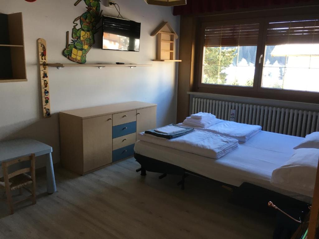 Postel nebo postele na pokoji v ubytování El Ladinia Someda