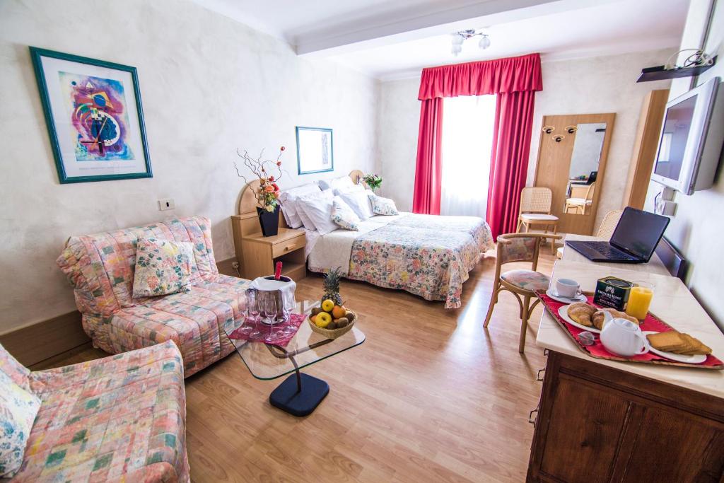 Postel nebo postele na pokoji v ubytování Hotel Centro