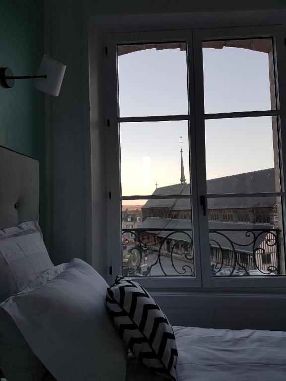 Postel nebo postele na pokoji v ubytování Mansion Victorine