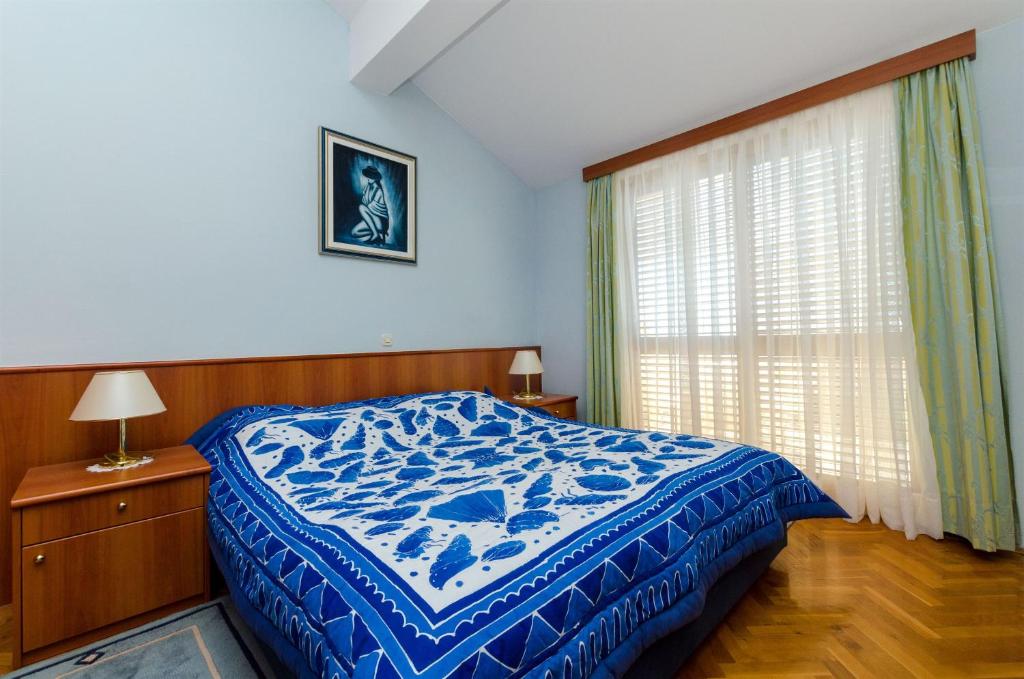 Posteľ alebo postele v izbe v ubytovaní Apartments Meridiana 2