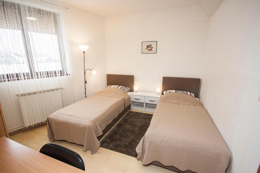Posteľ alebo postele v izbe v ubytovaní Apartment Karlovac