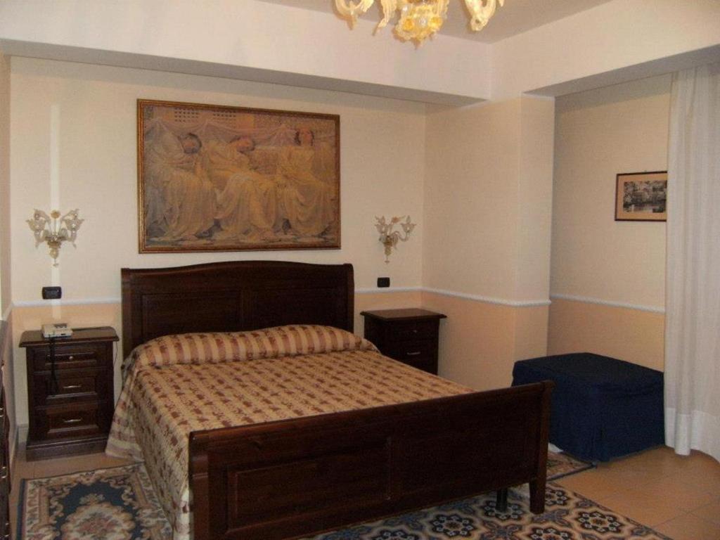 Postel nebo postele na pokoji v ubytování Hotel U' Bais