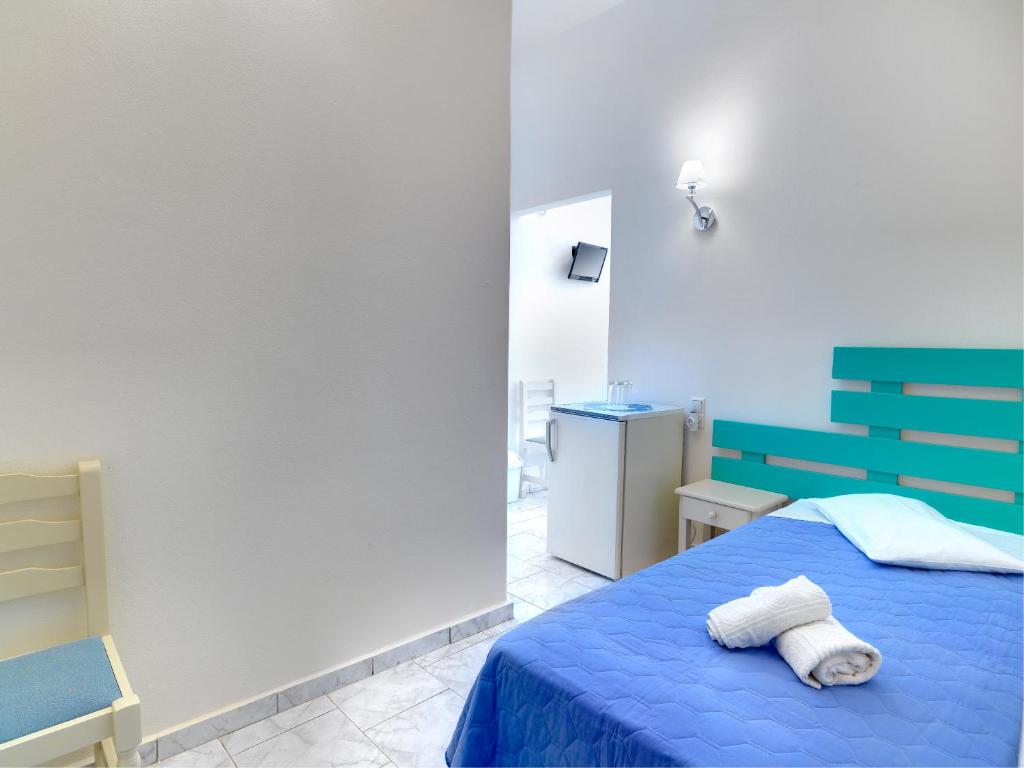 Postel nebo postele na pokoji v ubytování Hotel Kamelo