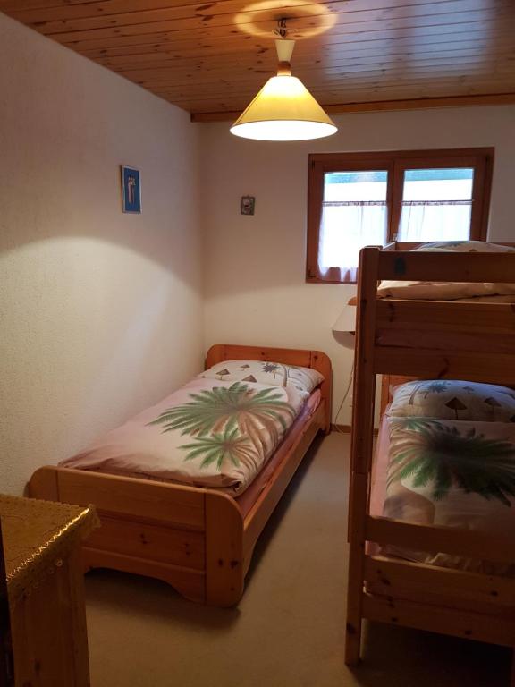 Postel nebo postele na pokoji v ubytování Bärgecho
