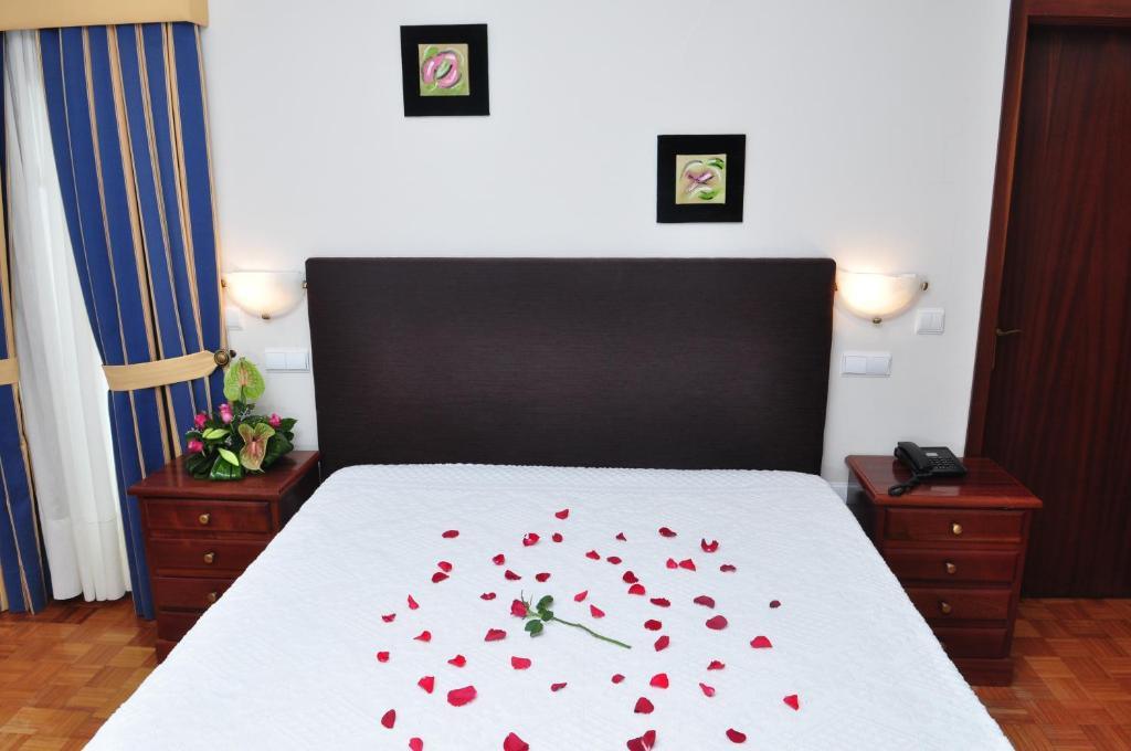 Postel nebo postele na pokoji v ubytování Moderna do Geres Hotel