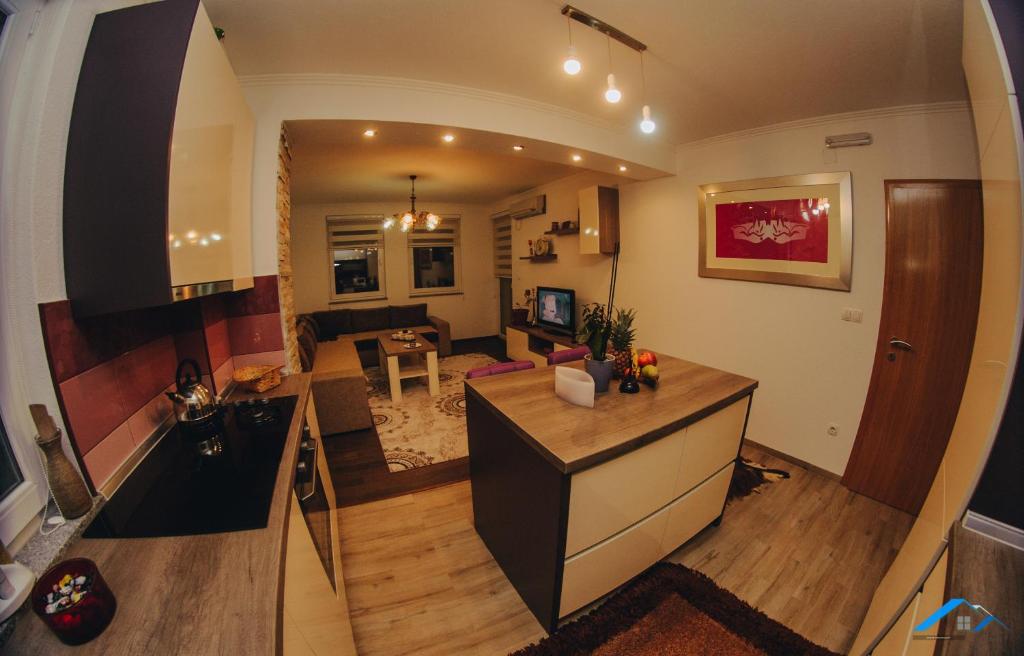an aerial view of a kitchen and living room at Brilliant Apartman in Bihać