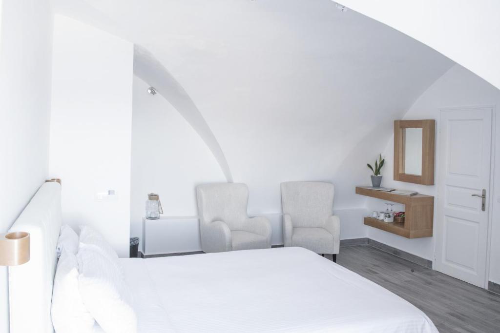 Postel nebo postele na pokoji v ubytování Hotel Thireas