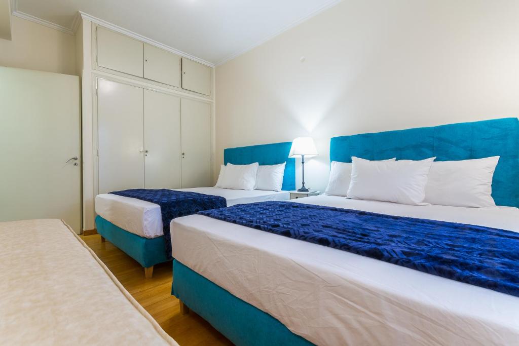 Postel nebo postele na pokoji v ubytování Victoria Queens Paradise Apartments