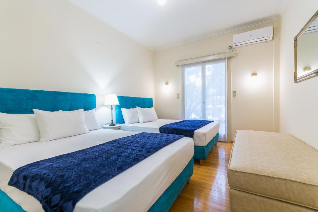 Postel nebo postele na pokoji v ubytování Victoria Queens Paradise Apartments