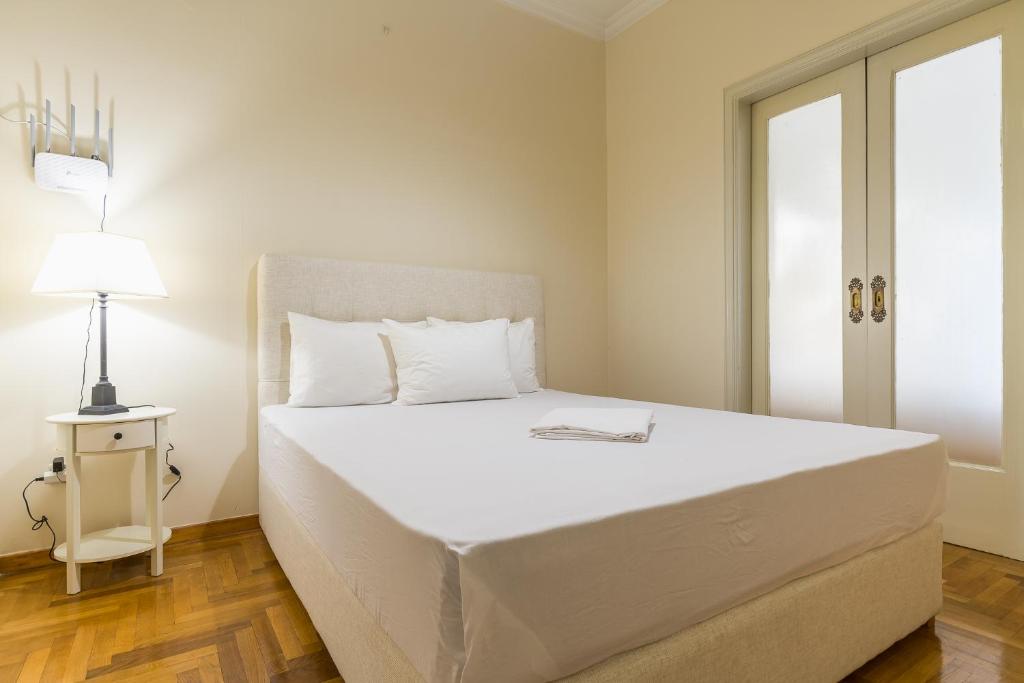 Postel nebo postele na pokoji v ubytování Victoria Queens Paradise Apartments
