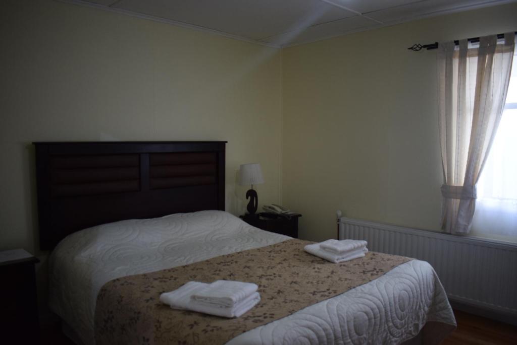 Uma cama ou camas num quarto em Hostal Loreto Belen