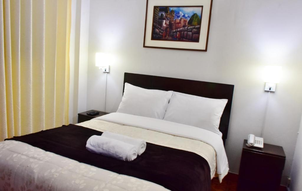 Postel nebo postele na pokoji v ubytování Machupicchu Guest House