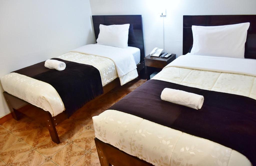 Postel nebo postele na pokoji v ubytování Machupicchu Guest House