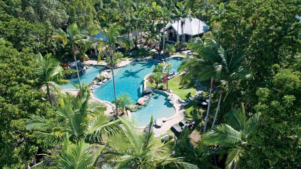 an aerial view of a pool at a resort at Paradise Links Resort Port Douglas in Port Douglas